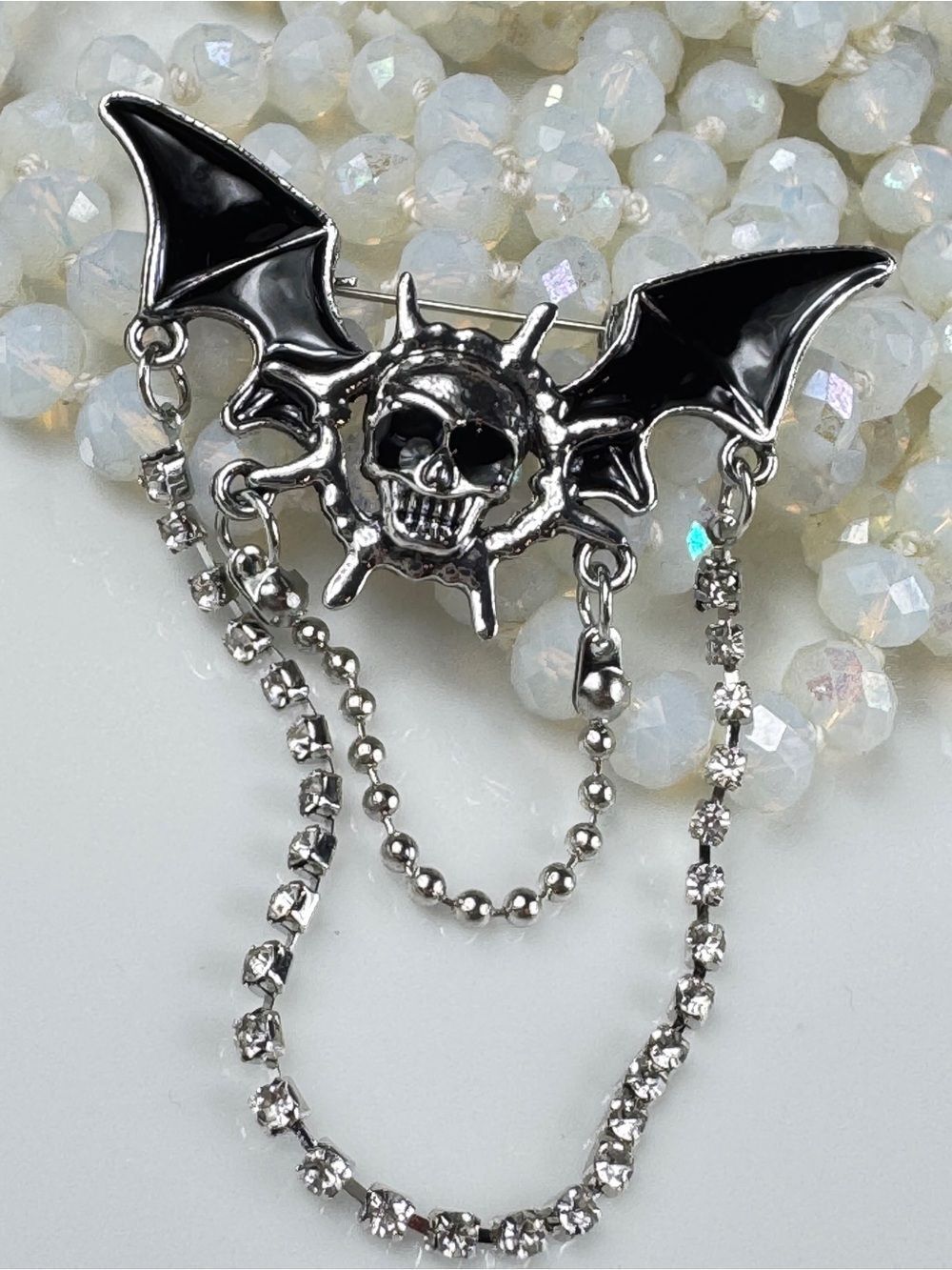 Silver Winged Skull Brooch with Black Enamel Accents